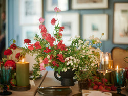 Red floral arrangements against a cool blue modern backdrop