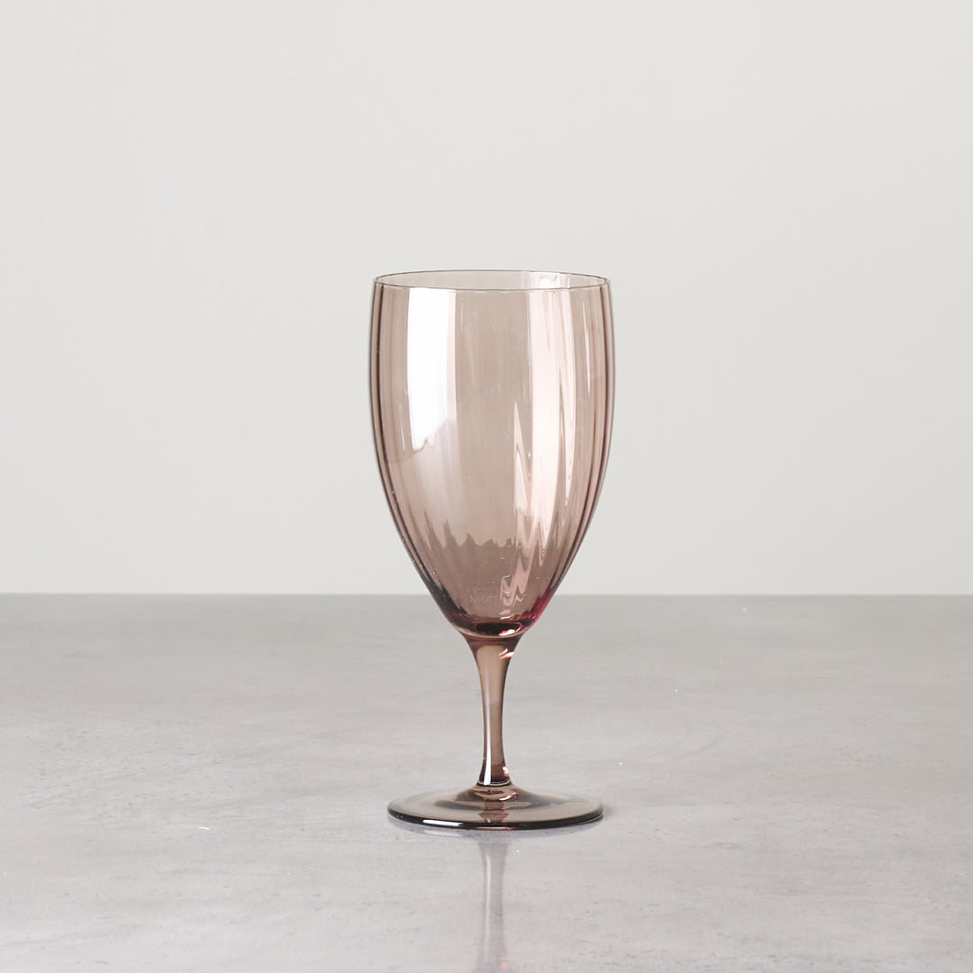 Brown-tinted water glass with short stem shown individually from the Aspen Walnut collection