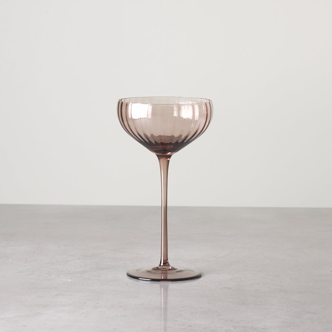 Brown-tinted coupe-style stemmed glass shown individually