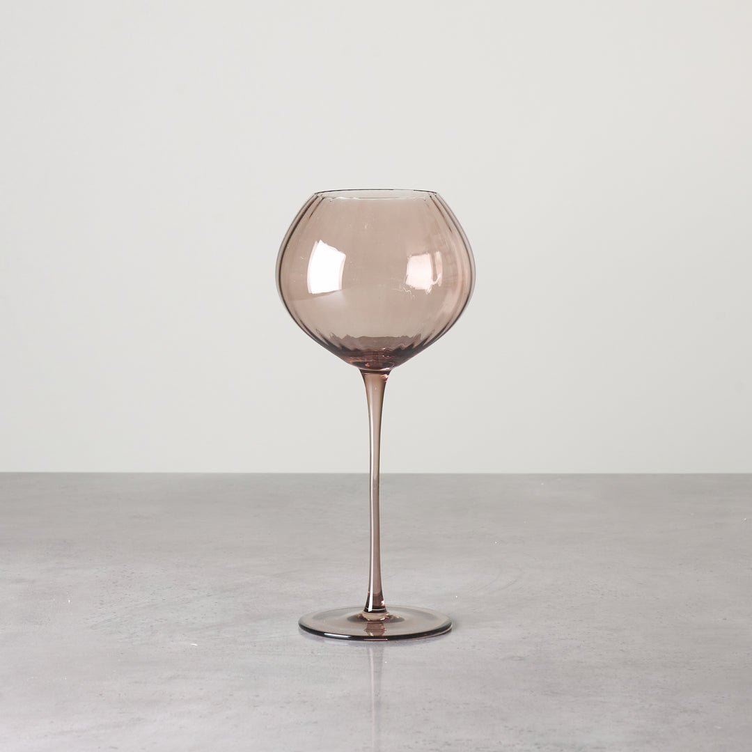 Brown-tinted glass stemware with rounded bowl shown individually