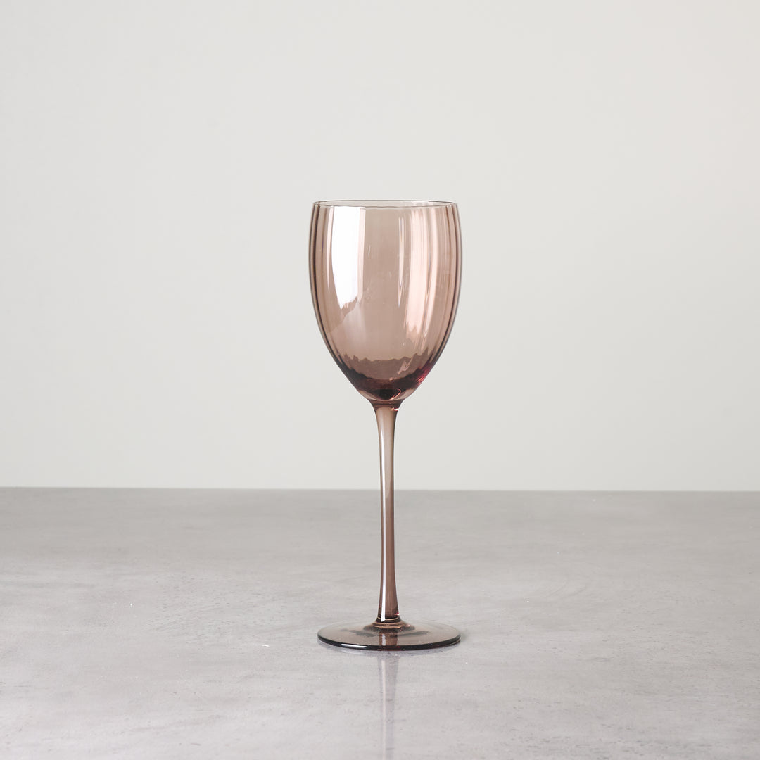 Brown-tinted glass stemware with tall, narrow bowl shown individually