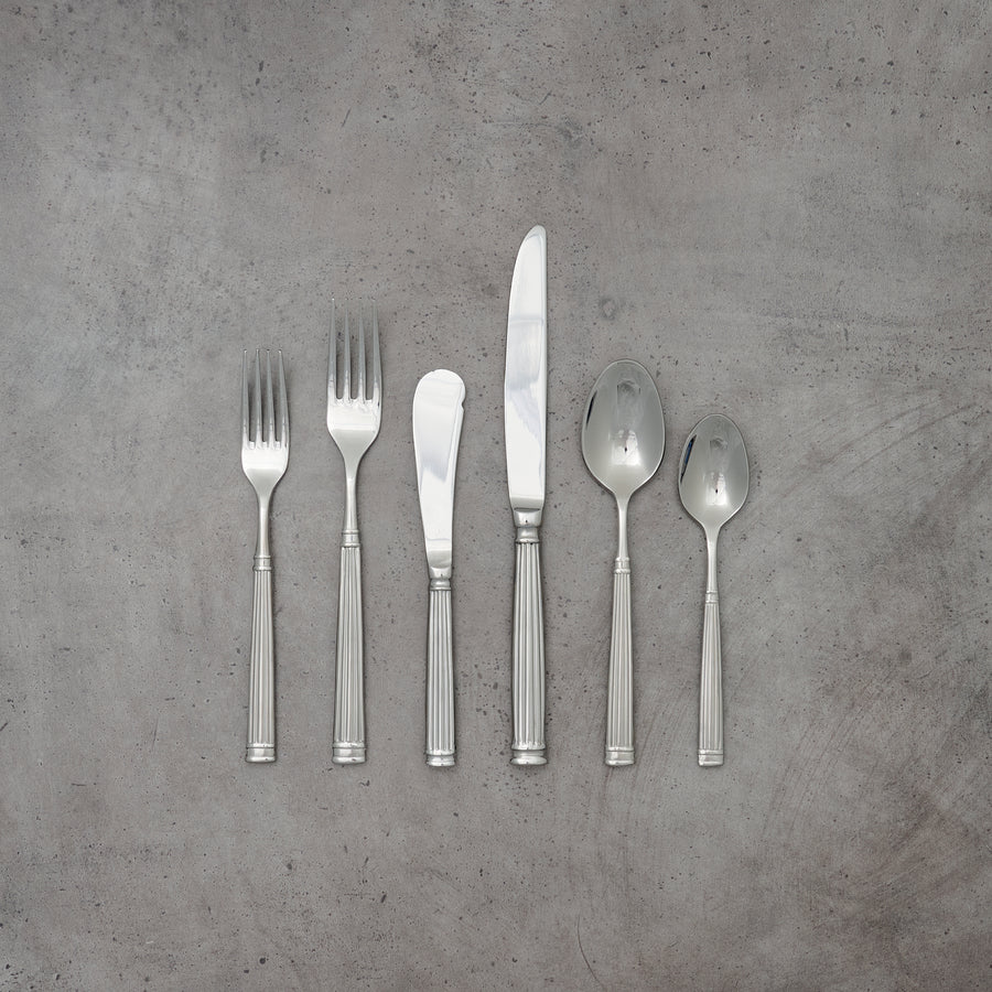 Modern fluted silver flatware collection, available for rent for weddings and corporate events. 